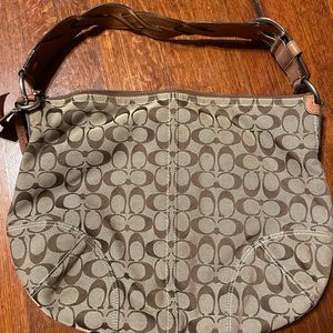 Coach Shoulder Bag brown and tan large sized can hold everything you need .